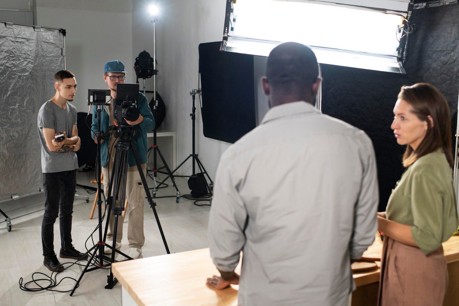 The Pure Vibes crew reviewing a shot together on set